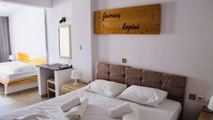 Triple room Ikaria at Kastro Hotel with balcony and city view