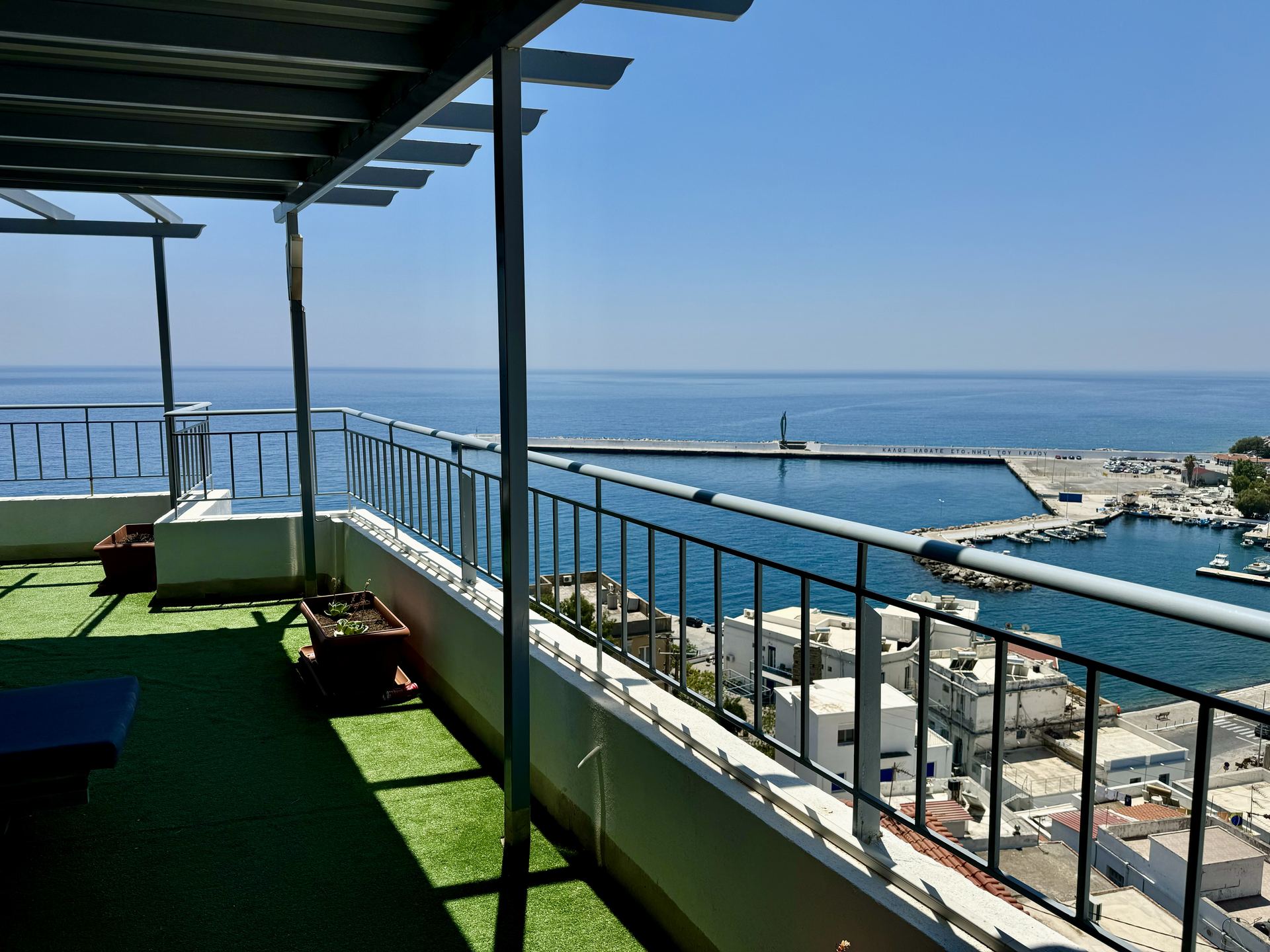 Kastro Hotel roof terrace with sea and port view, Agios Kirykos, Ikaria